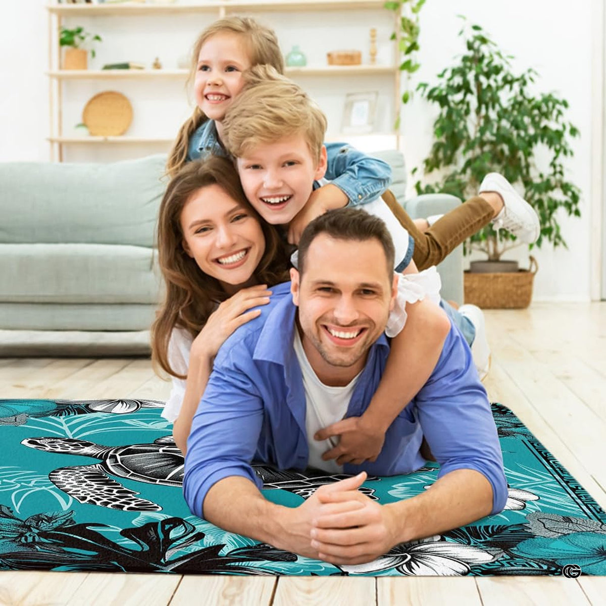 Lifestyle scene featuring family lounging on turquoise sea turtle area rug.