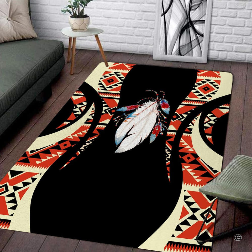 Southwestern geometric area rug displaying central beaded feather artwork and rust red diamond borders.