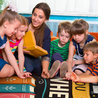 Lifestyle scene featuring teacher and students gathered around book area rug. - thumbnail image 5 of 7