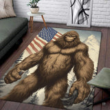 Muscular Bigfoot muscle mat area rug displaying a patriotic flag sky above alpine pine trees.