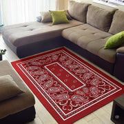 Detailed view of black and white ornate boteh flourishes on a red bandana background. - thumbnail image 2 of 9