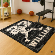 Close-up perspective of lacrosse player graphic art and turf camouflage pattern on black floor rug. - thumbnail image 4 of 9