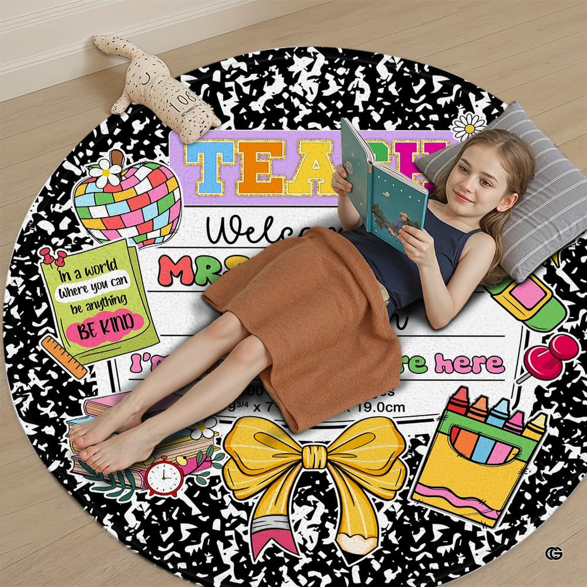 Decorative book area rug accenting a bright reading corner with pastel wall art.