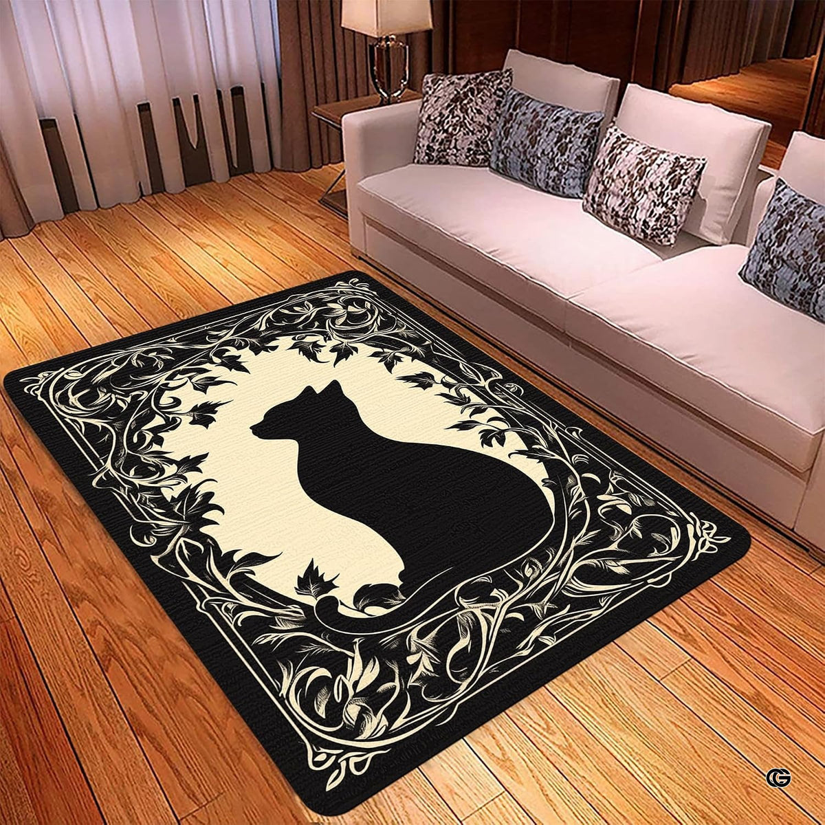 Close-up view of vintage scrolling vines and botanical leaf patterns on black cat area rug.