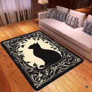 Close-up view of vintage scrolling vines and botanical leaf patterns on black cat area rug. - thumbnail image 2 of 5