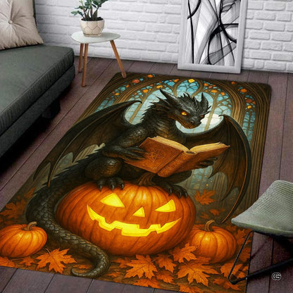 Black winged dragon reading a spellbook while sitting on a carved glowing Halloween pumpkin surrounded by autumn leaves area rug. - thumbnail image 2 of 8