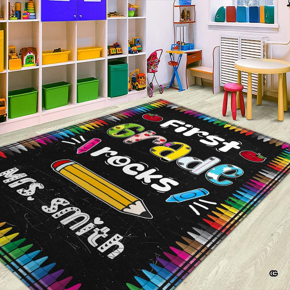 Classroom area rug with rainbow crayon border and chalkboard background for kindergarten circle time.