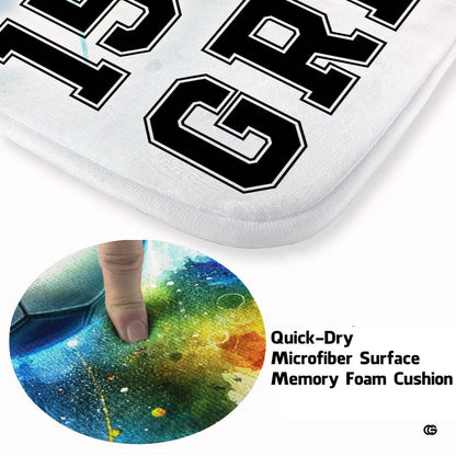 Detailed perspective of collegiate varsity number and explosive red ink splatters on soccer floor rug. - thumbnail image 3 of 8