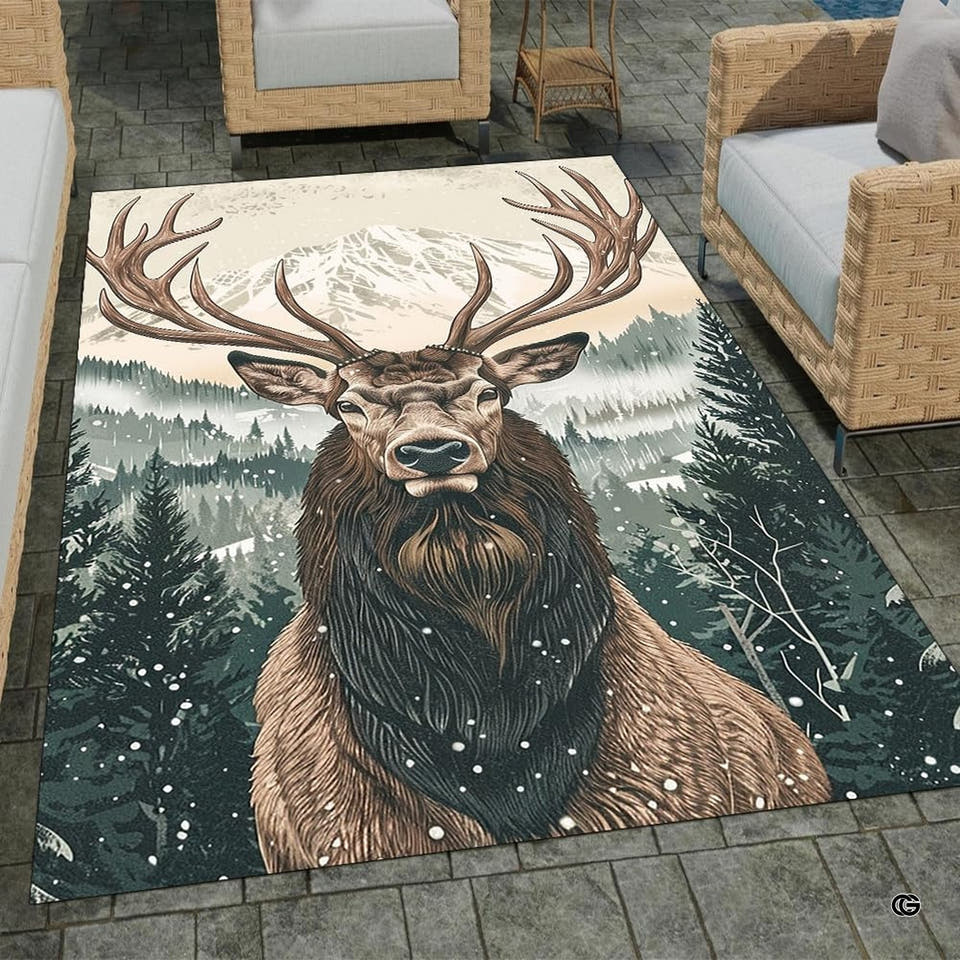 Top-down view of rectangular area rug displaying a bull elk in a snowy evergreen forest before mountain peaks.