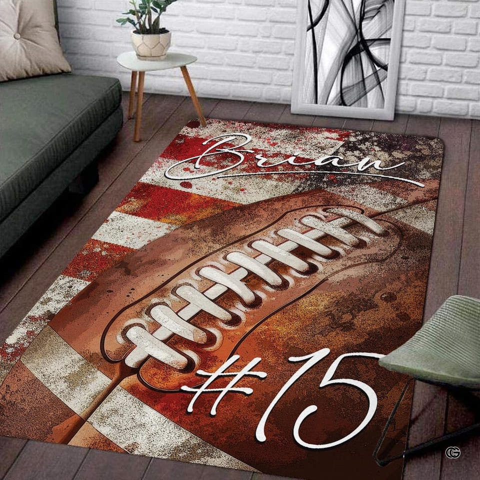 Sports themed bedroom rug showing vintage football over distressed flag stripes.