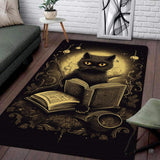 Gothic reading black cat with magic book rectangular area rug on black.