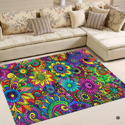 Detailed close-up of intricate blooming flower illustrations and bold black outlines on area rug. - thumbnail image 2 of 5