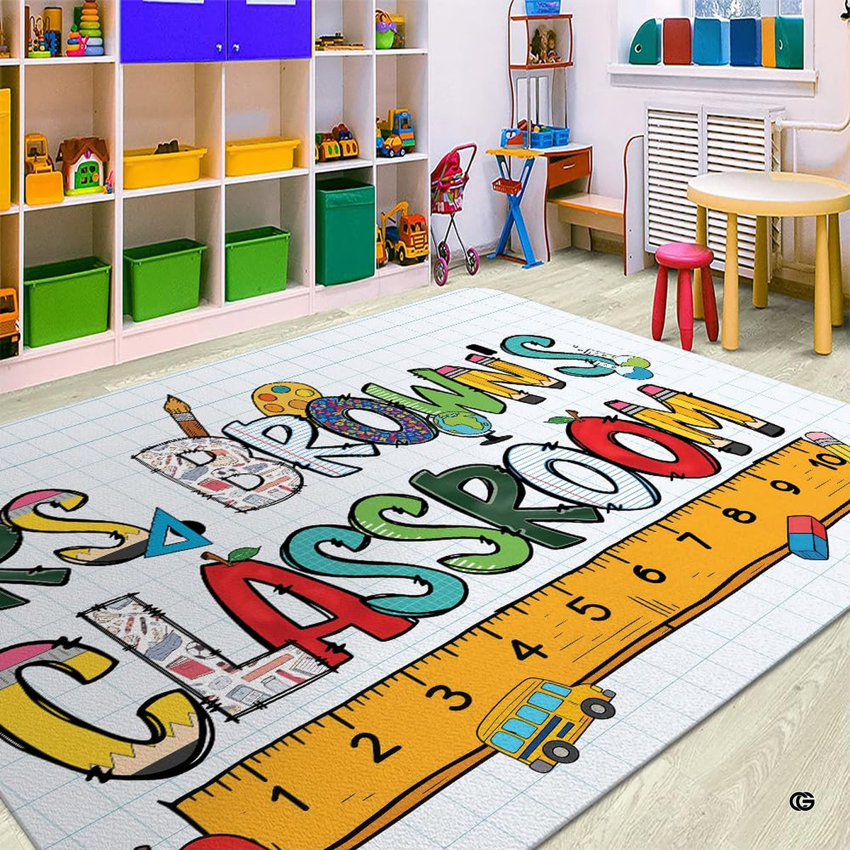 Educational theme area rug styled in bright study space with colorful wooden furniture. - image 3 of 7