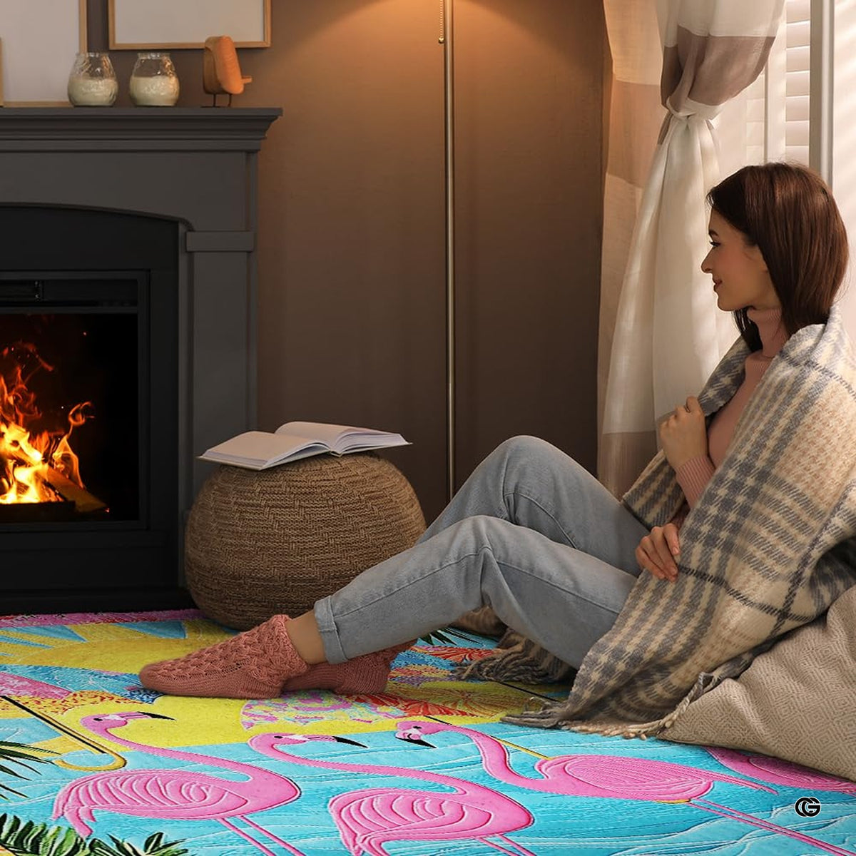 Cozy fireside reading nook with a person relaxing on the flamingo beach umbrellas floor rug - image 8 of 8