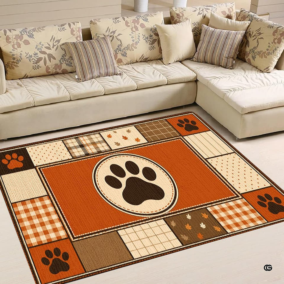 Autumn patchwork paw print rug featuring a center rust medallion and plaid border.