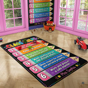 Close view of kids classroom mat showing cute cartoon smiling pencil faces, stars, and heart graphics. - thumbnail image 3 of 7