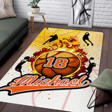 Flaming basketball surrounded by player action silhouettes rectangular area rug.