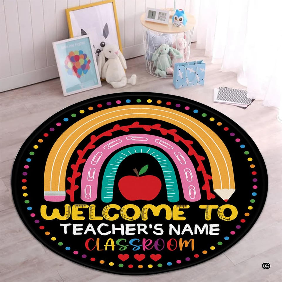 Kindergarten circle rug featuring boho pencil rainbow and red apple on black backdrop.