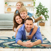 Coastal living room styling showing blue kraken nautical area rug centered under contemporary coffee table. - thumbnail image 5 of 7