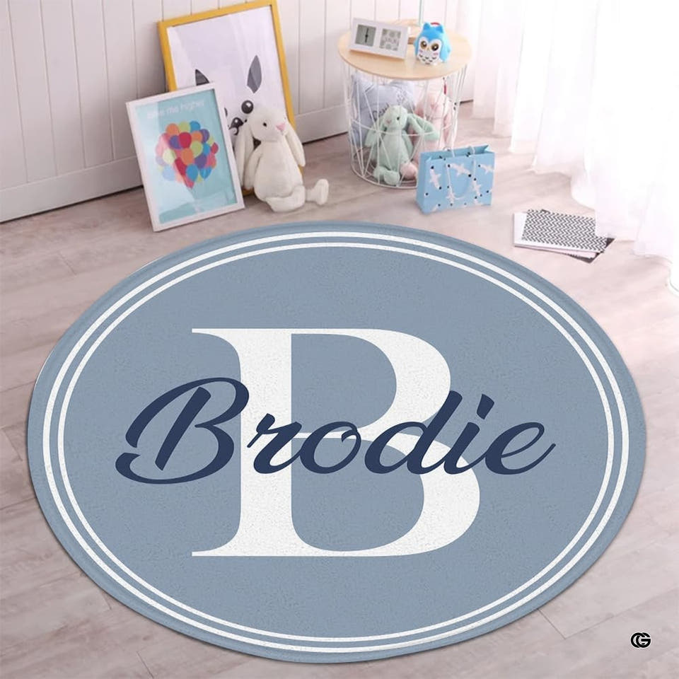 Blue-gray round initial rug in a nursery