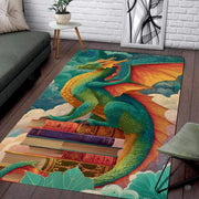 Emerald green and orange winged dragon perched on antique storybooks against a sky of pastel clouds area rug. - thumbnail image 6 of 6