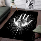 Gothic Hamsa Hand of Fatima area rug featuring celestial beams and all-seeing eye on black.