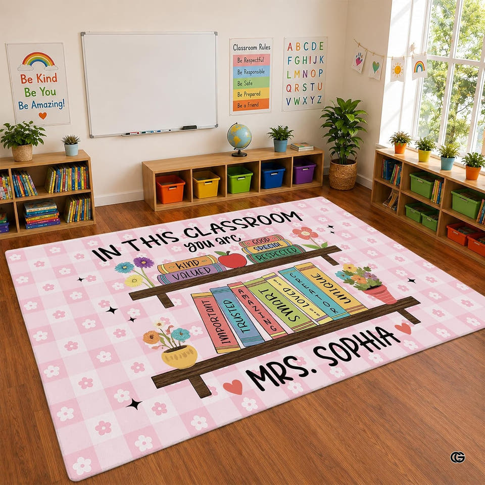 Classroom area rug featuring colorful alphabet blocks and playful rainbow border accents.