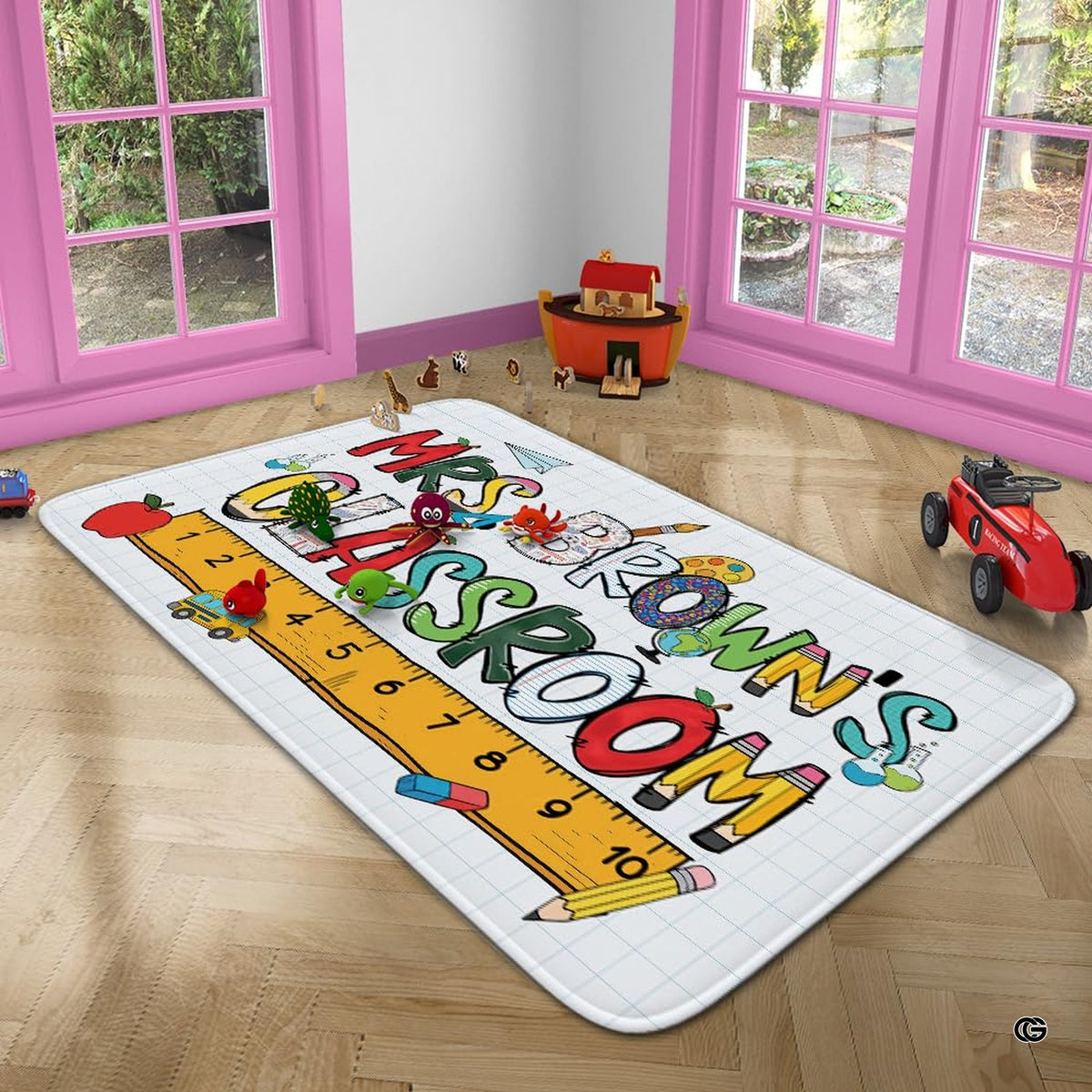 Notebook grid doodle area rug arranged beneath a wooden reading desk and activity chair.