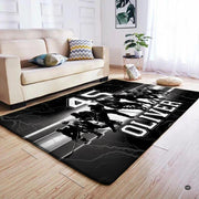 Close visual perspective of hockey area rug silhouetted skater artwork and contrasting speed trails. - thumbnail image 4 of 7