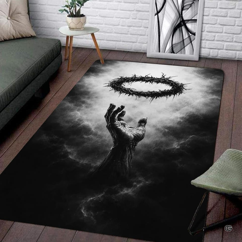 Monochrome gothic crown of thorns area rug positioned on dark floor beside gray couch and brick wall.