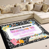 Scholastic marbled area rug displaying vintage stacked books and retro botanical illustrations.