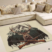 Rustic deer area rug featuring an antlered stag, pine forest, alpine peaks, and crossed hunting rifles. - thumbnail image 1 of 5