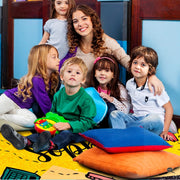 Children gathered around the teacher pencil rug during classroom circle time - thumbnail image 5 of 8