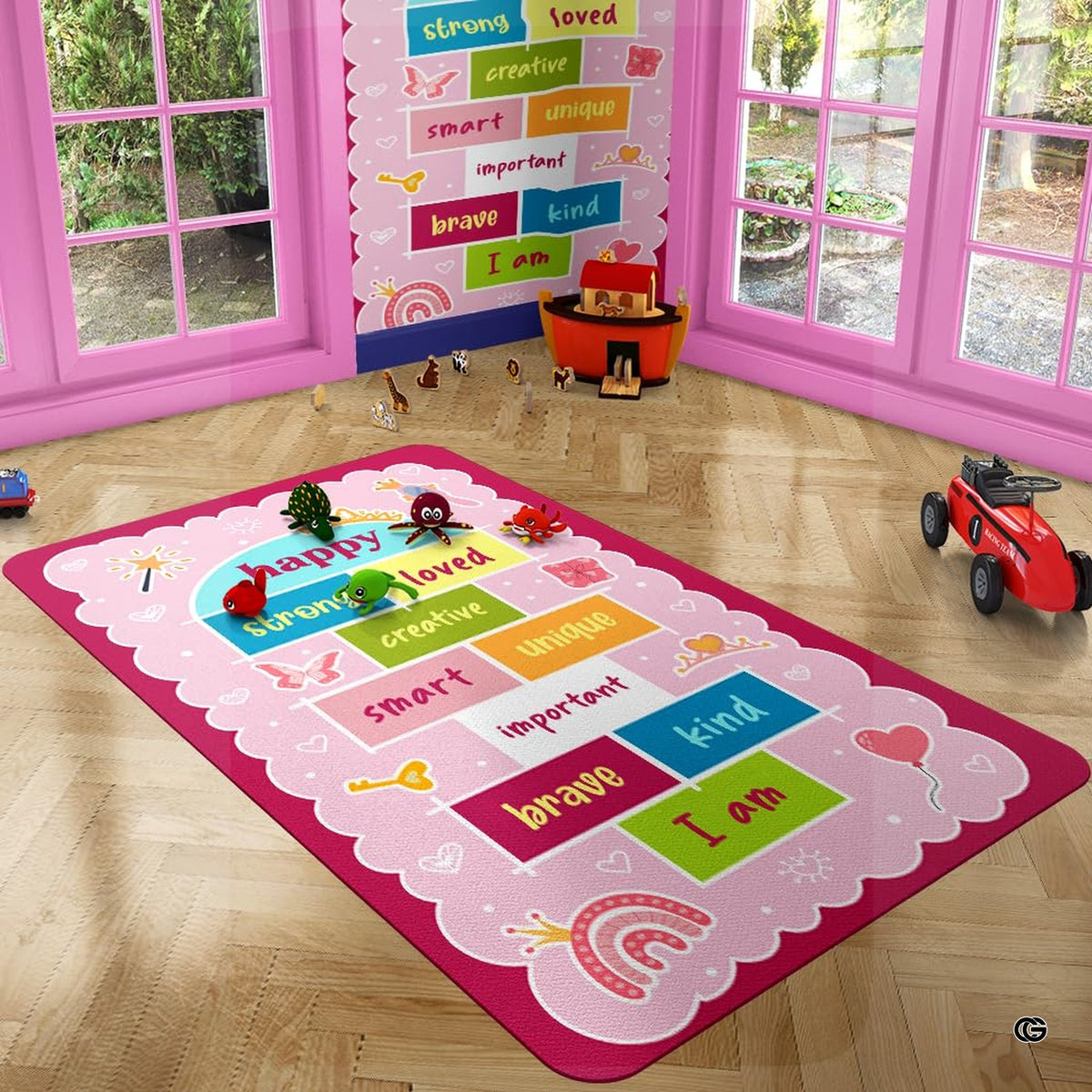 Detail view of golden tiara and hand mirror illustrations on the pink decorative accent area rug. - image 7 of 9