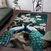 Moonlit peacock floral bird rug featuring turquoise plumage and pale magnolia blossoms on deep teal. - thumbnail image 1 of 7