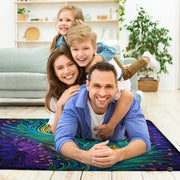 Fireside lounge setting with person relaxing near the violet peacock feather area rug - thumbnail image 5 of 7