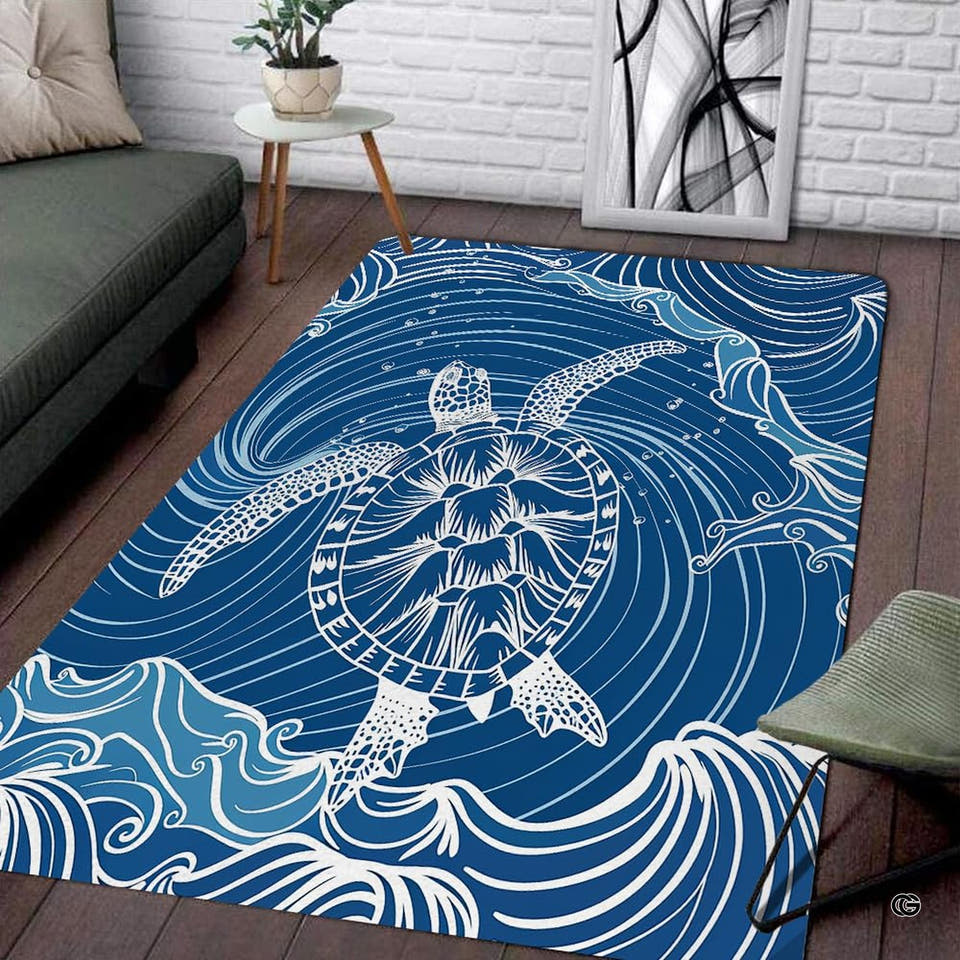 White line art sea turtle swimming through swirling ocean waves on a navy blue area rug