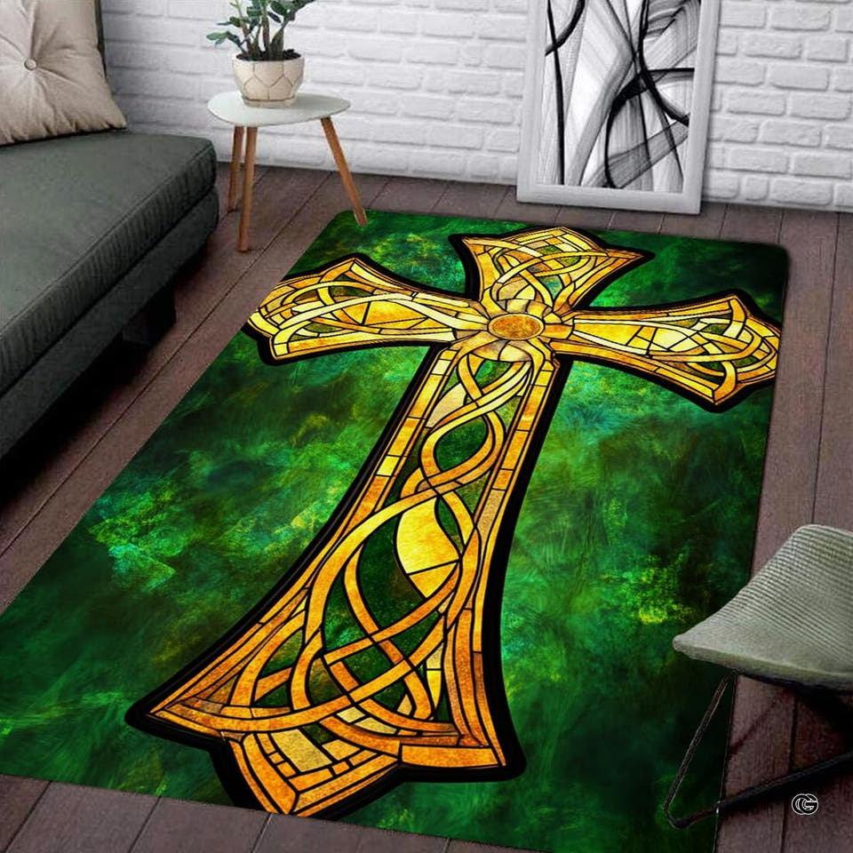 Celtic knotwork stained glass area rug featuring an ornate golden cross over emerald stone.