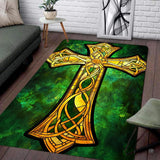 Celtic knotwork stained glass area rug featuring an ornate golden cross over emerald stone.