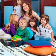 Sunlit study area with the social-emotional learning rug placed beside a low bookshelf - thumbnail image 6 of 9