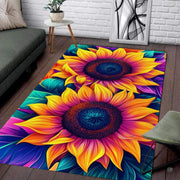 Sunroom setting featuring the vibrant sunflower outdoor area rug design alongside verdant potted greenery. - thumbnail image 7 of 8