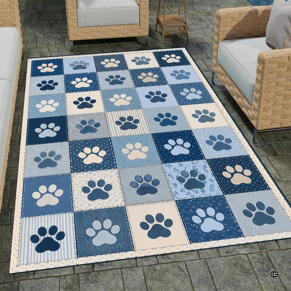Denim patchwork dog print rug with navy blue squares and cream paw motifs.