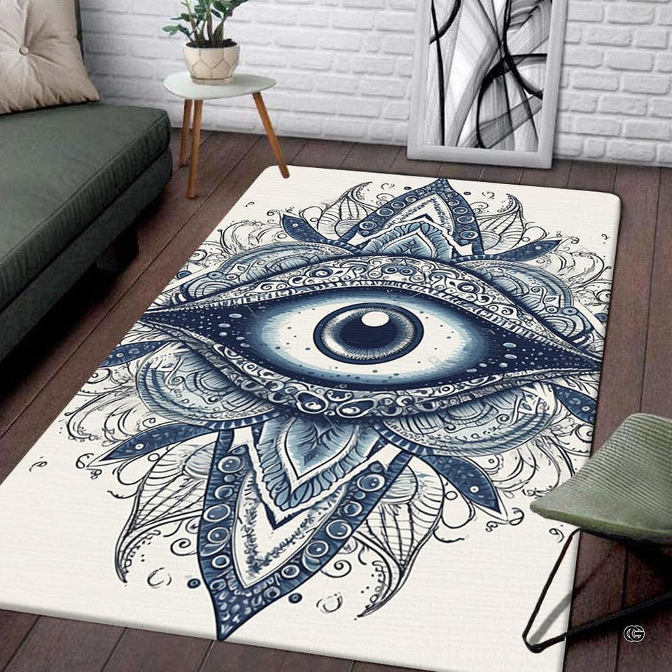 Rectangular white area rug with intricate indigo all-seeing eye mandala illustration