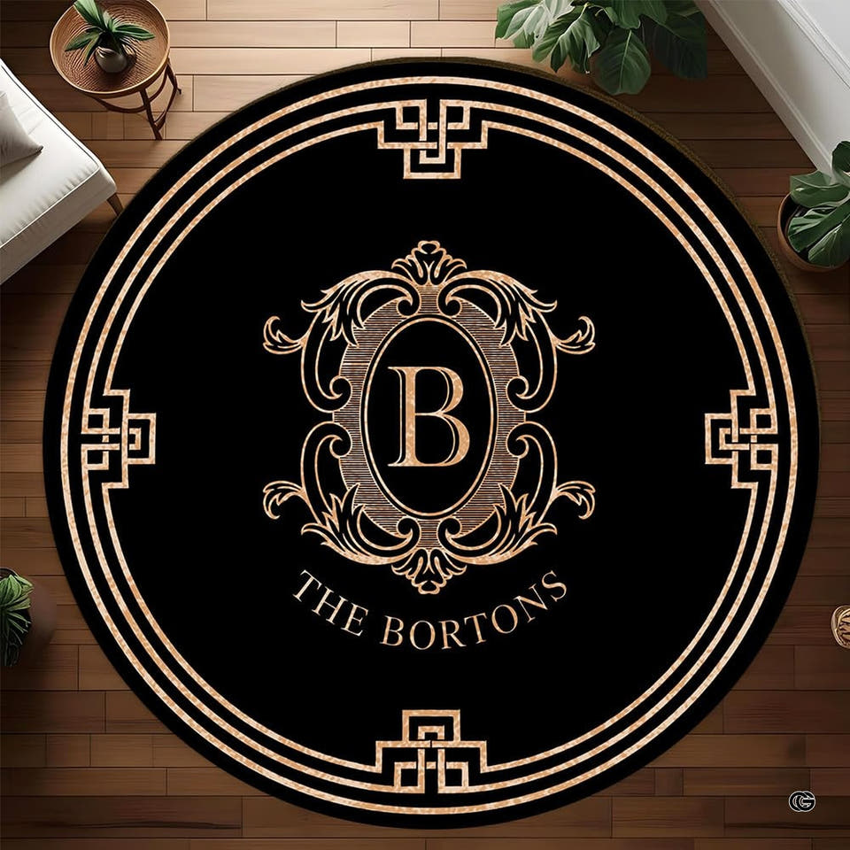 Baroque greek key monogram crest black gold area rug - primary perspective