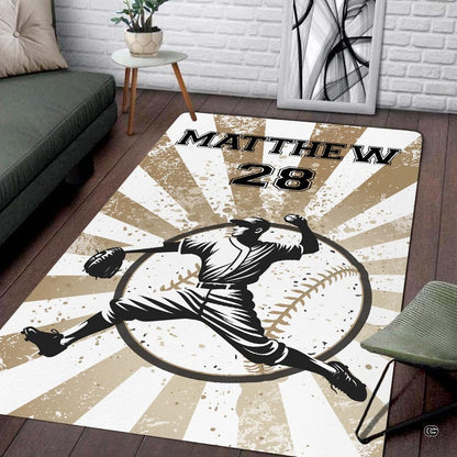 Vintage baseball pitcher illustration area rug featuring earthy tan distressed sunburst artwork. - thumbnail image 1 of 7