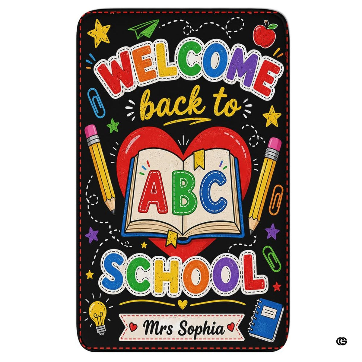 Schoolhouse area rug highlighting a chalkboard illustration of an open storybook and red heart.