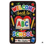 Schoolhouse area rug highlighting a chalkboard illustration of an open storybook and red heart. - thumbnail image 1 of 7