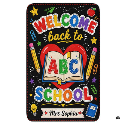 Schoolhouse area rug highlighting a chalkboard illustration of an open storybook and red heart. - thumbnail image 1 of 7