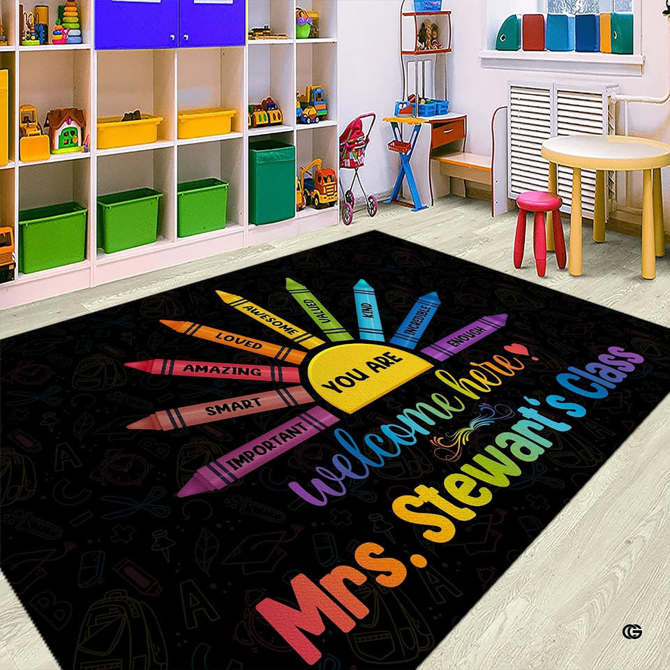 Colorful crayon themed classroom area rug displayed on wooden flooring in front of toy storage cubbies.
