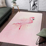 Living room setup with couch and white brick wall showcasing watercolor pink flamingo area rug - thumbnail image 1 of 7